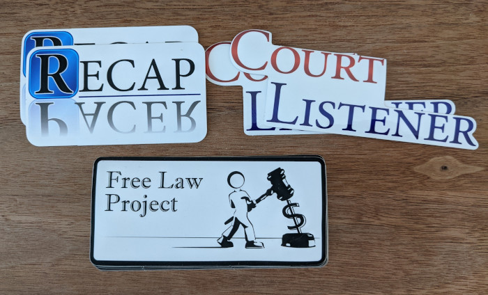 RECAP, FLP, and CourtListener stickers on a table